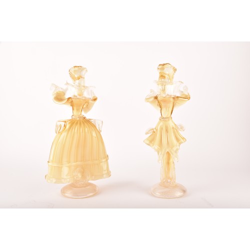 303 - A pair of Venetian Murano glass decorative figures, in gilt and white glass, in the form of a man an... 