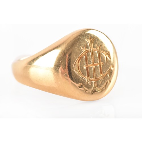 96 - A 18 carat yellow gold engraved signet ring, engraved plaque top, worn English hallmarks, maker's ma... 