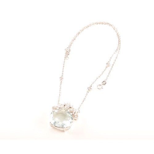 80 - A 18ct white gold pendant and chain, featuring an oval aquamarine with an approximate weight of 12.0... 