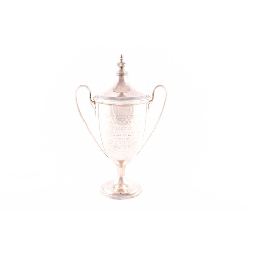 174 - A Edward VII silver trophy cup and cover, hallmarked Birmingham 1908 by Elkington & Co Ltd, twin... 