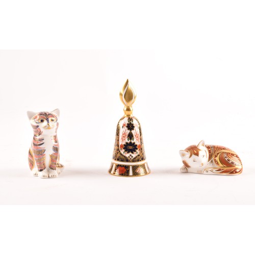 259 - A group of three early 21st century Royal Crown Derby pieces, to include a sitting cat paperweight w... 