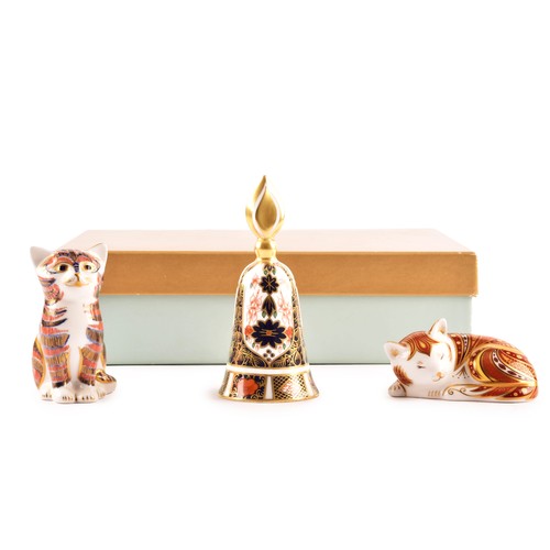 259 - A group of three early 21st century Royal Crown Derby pieces, to include a sitting cat paperweight w... 