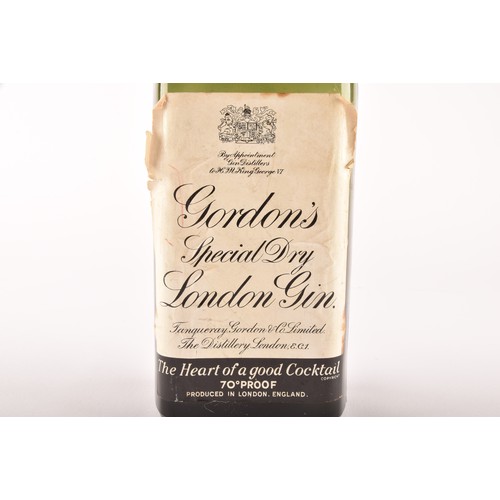 297 - A mid 20th century bottle of Gordons Special Dry London Gin, 70° Proof, no bottle size stated but be... 