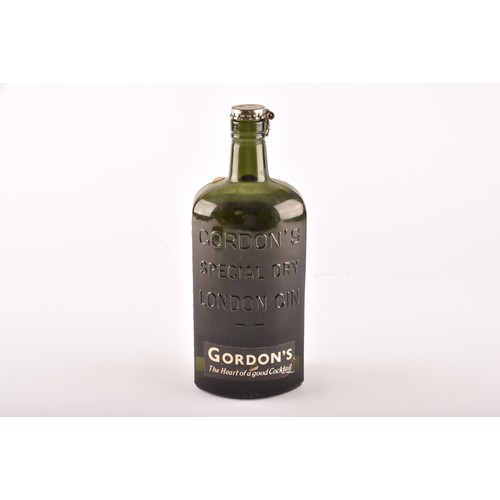 297 - A mid 20th century bottle of Gordons Special Dry London Gin, 70° Proof, no bottle size stated but be... 