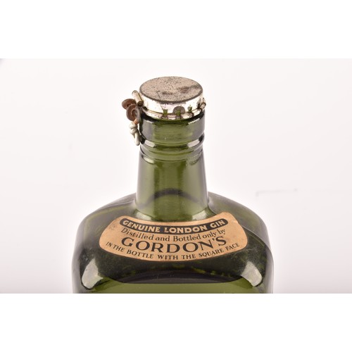 297 - A mid 20th century bottle of Gordons Special Dry London Gin, 70° Proof, no bottle size stated but be... 