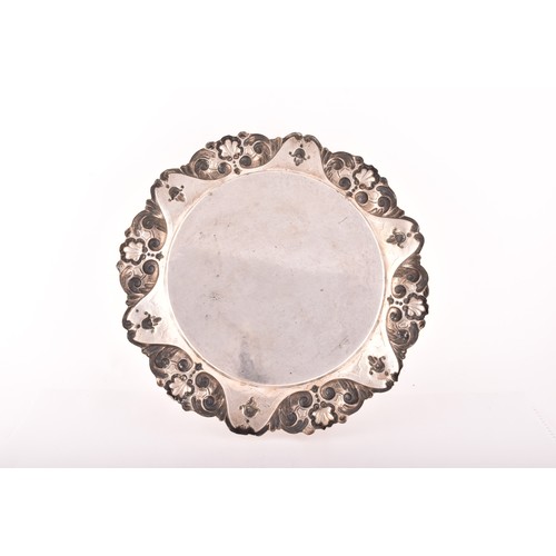 192 - A circular tray with heavily embossed border decoration, 36 x 36 cm, 22.1 ozt / 690 grams.