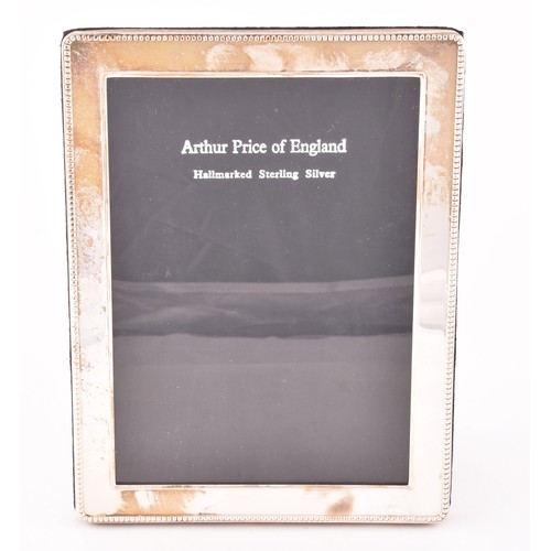 219 - A Elizabeth II silver photo frame, hallmarked London 2000 by Arthur Price, beaded border design, siz... 