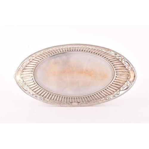 207 - A Victorian silver bon bon dish, hallmarked England 1859 by C.F, boat shaped with half ribbed decora... 