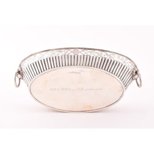 207 - A Victorian silver bon bon dish, hallmarked England 1859 by C.F, boat shaped with half ribbed decora... 