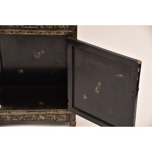 39 - A modern Japanese black lacquer display cabinet, gilt and polychrome decorated, the upper section wi... 