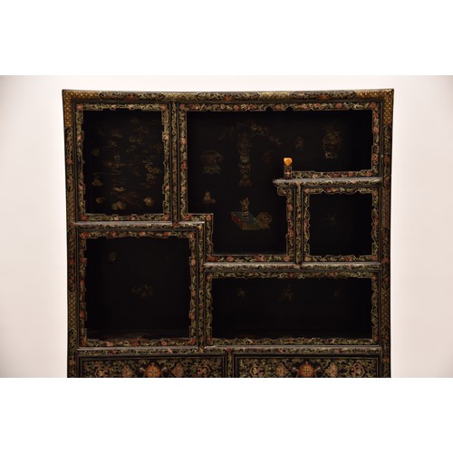 39 - A modern Japanese black lacquer display cabinet, gilt and polychrome decorated, the upper section wi... 