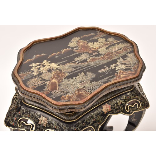 48 - A large Japanese black lacquer jardiniere stand, the top deorated with an extensive mountainous lans... 