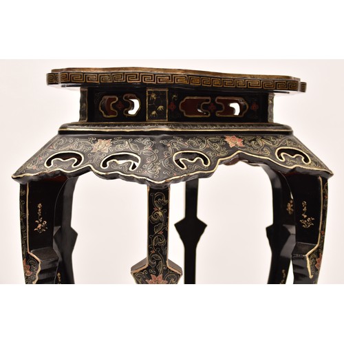 48 - A large Japanese black lacquer jardiniere stand, the top deorated with an extensive mountainous lans... 