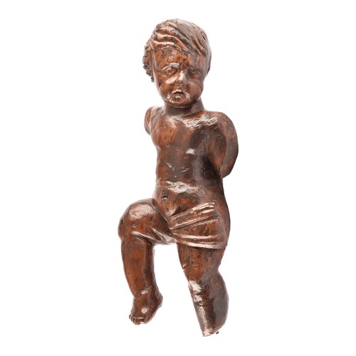 243 - A 19th century Italian carved fruit wood sculpture of a cherub, in tradition pose, with one leg rais... 