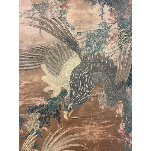 25 - A 19th century Chinese silkwork decorated scroll depicting an eagle in pursuit of a smaller bird, su... 