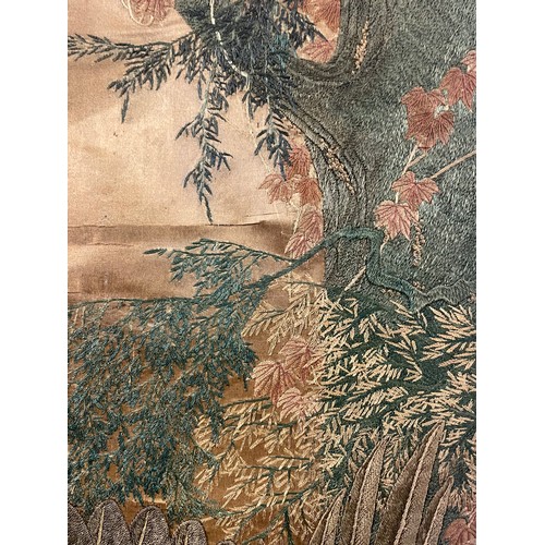 25 - A 19th century Chinese silkwork decorated scroll depicting an eagle in pursuit of a smaller bird, su... 