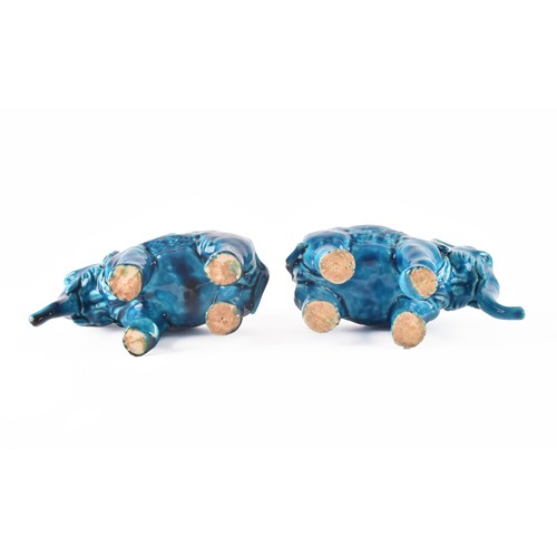 268 - Paul Milet (French, 1870-1950), a pair of French Sevres turquoise glazed ceramic elephants, 15.5 x 1... 