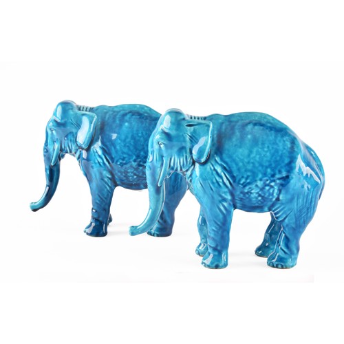 268 - Paul Milet (French, 1870-1950), a pair of French Sevres turquoise glazed ceramic elephants, 15.5 x 1... 