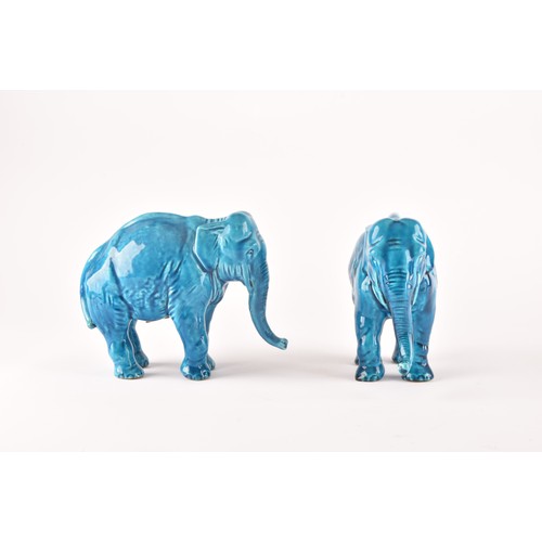 268 - Paul Milet (French, 1870-1950), a pair of French Sevres turquoise glazed ceramic elephants, 15.5 x 1... 