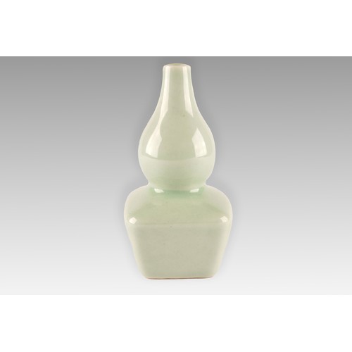 7 - A Chinese celadon glazed porcelain vase, the top of gourd shape, with rounded square section lower h... 