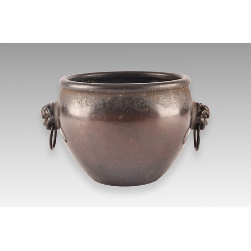 37 - An 18th century Chinese bronze bowl, with a rolled rim, dogs of foe handles, impressed Chinese chara... 