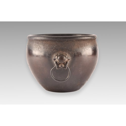 37 - An 18th century Chinese bronze bowl, with a rolled rim, dogs of foe handles, impressed Chinese chara... 