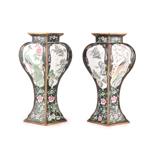 44 - A pair of 20th century enamel vases, each decorated with floral and hand painted exotic birds in car... 