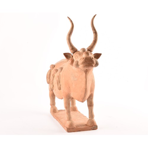 46 - A Chinese painted pottery ox (Northern Qi, 549-577 AD), the beast in standing pose with head raised,... 