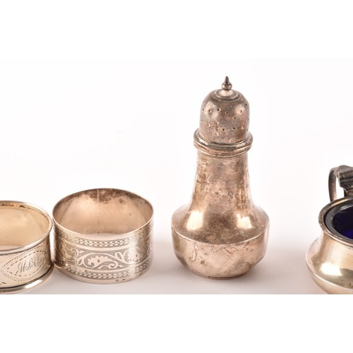 181 - A collection of silver napkin rings and silver cruet sets from various dates and makers, 4.8 ozt / 1... 