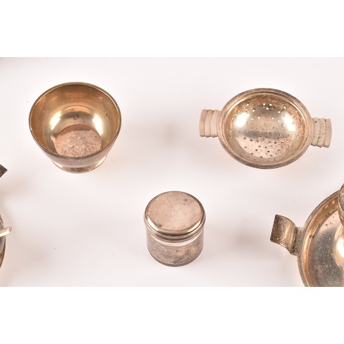 184 - A group of silver items to include two condiment sets, two ladles, a tea strainer, a trinket box, a ... 