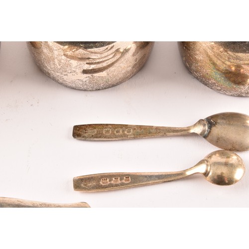 184 - A group of silver items to include two condiment sets, two ladles, a tea strainer, a trinket box, a ... 