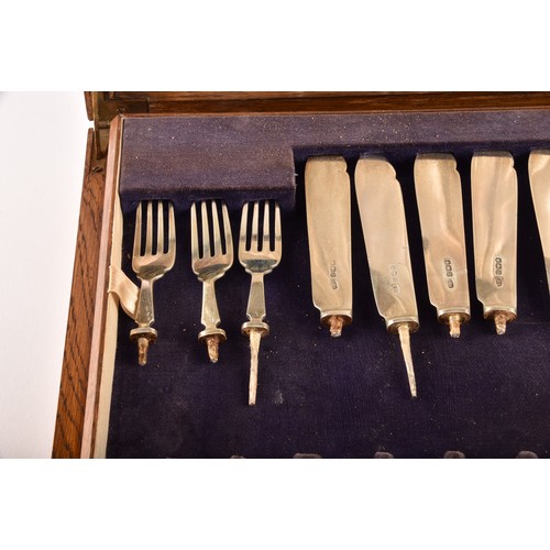 184 - A group of silver items to include two condiment sets, two ladles, a tea strainer, a trinket box, a ... 