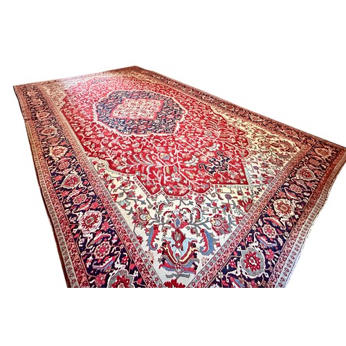 281 - A very large Persian Tabriz wool carpet featuring a large central medallion with detailed floral pat... 