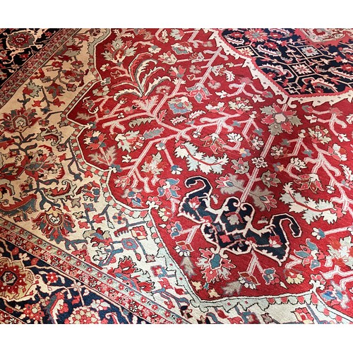 281 - A very large Persian Tabriz wool carpet featuring a large central medallion with detailed floral pat... 