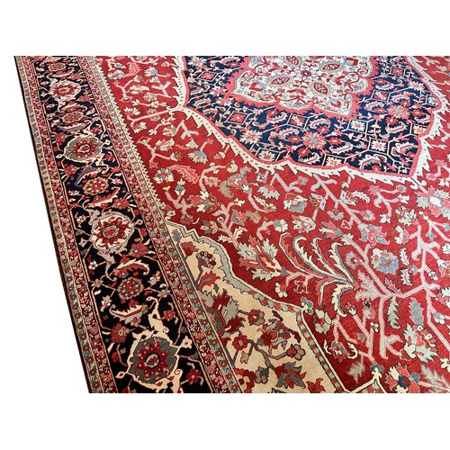 281 - A very large Persian Tabriz wool carpet featuring a large central medallion with detailed floral pat... 