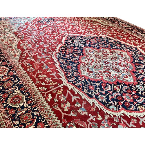 281 - A very large Persian Tabriz wool carpet featuring a large central medallion with detailed floral pat... 