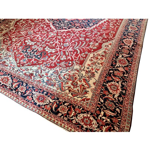 281 - A very large Persian Tabriz wool carpet featuring a large central medallion with detailed floral pat... 