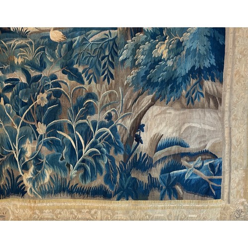 283 - A large antique European handwoven pastoral needlework tapestry depicting a woodland scene with lush... 