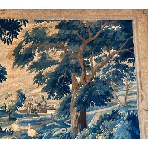 283 - A large antique European handwoven pastoral needlework tapestry depicting a woodland scene with lush... 