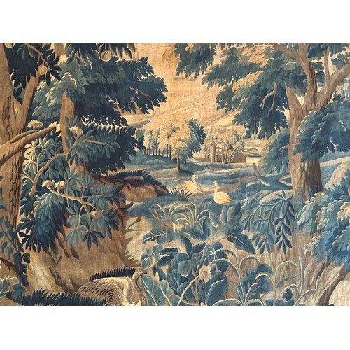 283 - A large antique European handwoven pastoral needlework tapestry depicting a woodland scene with lush... 