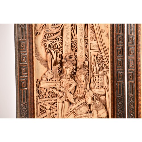 47 - A large Chinese carved wooden four fold dressing screen, elaborately carved with scenes of women in ... 