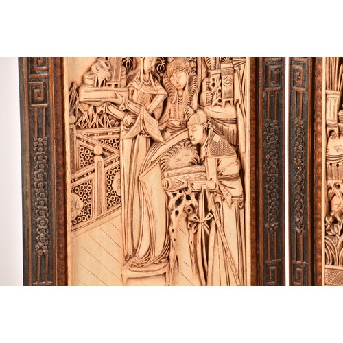 47 - A large Chinese carved wooden four fold dressing screen, elaborately carved with scenes of women in ... 