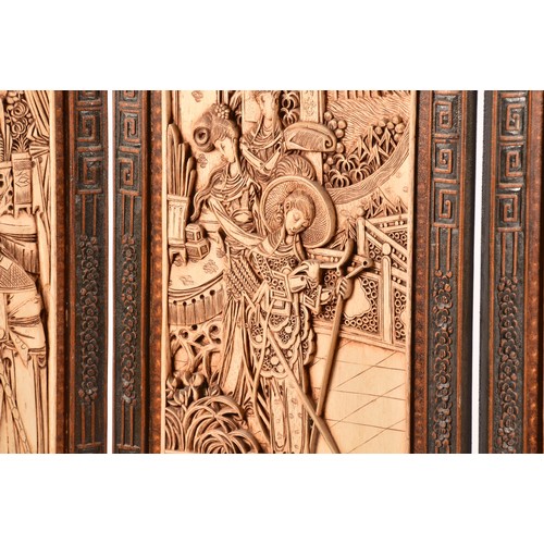 47 - A large Chinese carved wooden four fold dressing screen, elaborately carved with scenes of women in ... 