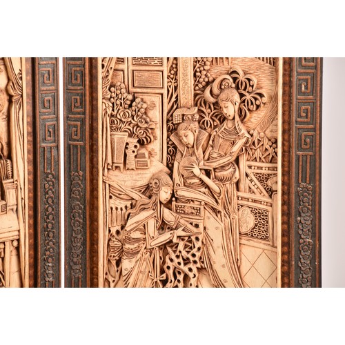 47 - A large Chinese carved wooden four fold dressing screen, elaborately carved with scenes of women in ... 