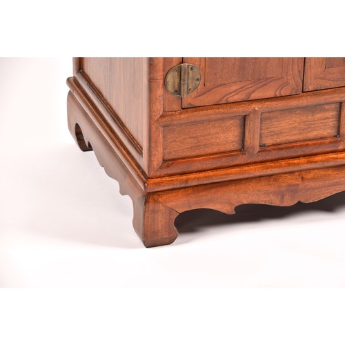 50 - A large Chinese hardwood three tier whatnot, each level inset with three small drawers, the base wit... 