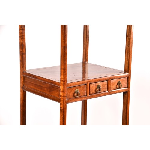 50 - A large Chinese hardwood three tier whatnot, each level inset with three small drawers, the base wit... 