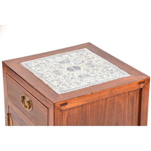 52 - the top with inset Chinese blue and white tile decorated with flowers and leaves, over a single draw... 