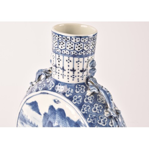 5 - A Chinese blue and white moon flask, with twin dragon handles, the body painted with a scene of figu... 