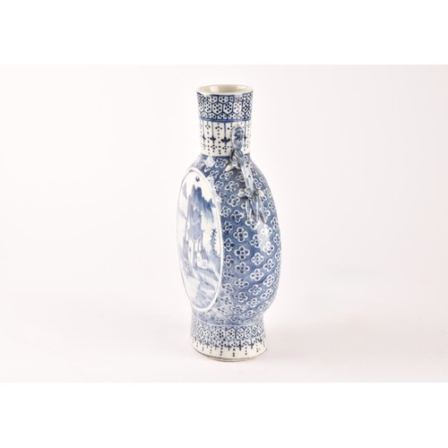 5 - A Chinese blue and white moon flask, with twin dragon handles, the body painted with a scene of figu... 