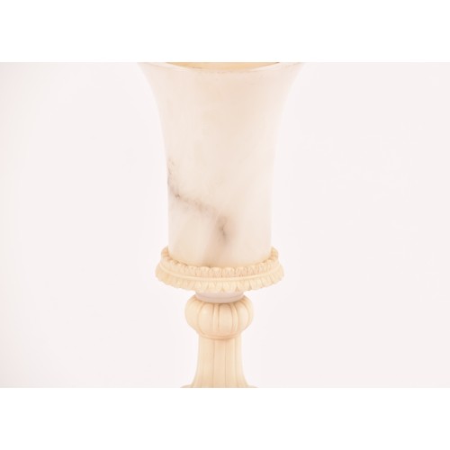 245 - A large alabaster and marble table lamp with shade, of urn form and supported on a fluted stem to a ... 